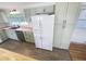 Bright kitchen with stainless steel appliances, wooden countertops, and painted cabinets at 4722 Harris Ave, Sarasota, FL 34233