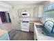 Bright kitchen featuring updated appliances, wooden countertops, and painted cabinets at 4722 Harris Ave, Sarasota, FL 34233