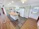 Well-lit kitchen with an island and stainless steel appliances at 4722 Harris Ave, Sarasota, FL 34233