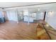 Open floor plan featuring hardwood flooring that connects the living room to the kitchen at 4722 Harris Ave, Sarasota, FL 34233