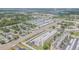 Expansive aerial view of the community showcasing residences, lush landscaping, and a glimpse of the water at 5501 80Th N St # 206, St Petersburg, FL 33709