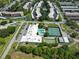 Aerial view of the community highlighting amenities such as a pool, tennis court, and recreational area at 5501 80Th N St # 206, St Petersburg, FL 33709