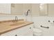 Bathroom with granite countertop, white vanity, tile floors, and modern fixtures at 5501 80Th N St # 206, St Petersburg, FL 33709