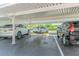 Designated carport parking area providing covered spaces for residents' vehicles and protection from the elements at 5501 80Th N St # 206, St Petersburg, FL 33709