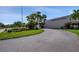 Welcoming entrance to Magnolia Sun Center, featuring landscaped greenery and a well-maintained driveway at 5501 80Th N St # 206, St Petersburg, FL 33709