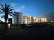 Exterior view of a condominium complex and the carports are conveniently located nearby at 5501 80Th N St # 206, St Petersburg, FL 33709