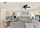 A well lit living room has tile flooring and is decorated with stylish furniture at 5501 80Th N St # 206, St Petersburg, FL 33709