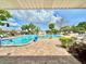 Inviting community pool and spa area with lounge chairs, perfect for soaking up the sun and relaxing outdoors at 5501 80Th N St # 206, St Petersburg, FL 33709