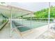 Covered shuffleboard courts with multiple lanes and bench seating at 5501 80Th N St # 206, St Petersburg, FL 33709