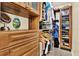 Spacious wooden walk-in closet with shelving, drawers, and mirrored doors at 5501 80Th N St # 206, St Petersburg, FL 33709