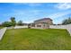 Expansive backyard featuring a white fence at 5624 Fisher Glen Loop, Wesley Chapel, FL 33545