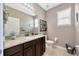 Stylish half-bathroom featuring elegant granite countertops and modern fixtures at 5624 Fisher Glen Loop, Wesley Chapel, FL 33545