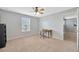 Bedroom features a desk and a ceiling fan for added comfort at 5624 Fisher Glen Loop, Wesley Chapel, FL 33545