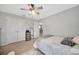 Bedroom with carpet, ceiling fan, and closet with view into hallway at 5624 Fisher Glen Loop, Wesley Chapel, FL 33545