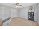 Bright bedroom features a ceiling fan and ample closet space at 5624 Fisher Glen Loop, Wesley Chapel, FL 33545