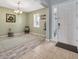 Bright foyer with tile and wood-look floors, and a decorative rug creating a welcoming entrance at 5624 Fisher Glen Loop, Wesley Chapel, FL 33545