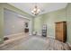 Bright foyer with tile and wood-look floors, and a decorative rug creating a welcoming entrance at 5624 Fisher Glen Loop, Wesley Chapel, FL 33545