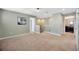 Bright and airy hallway with neutral tones and access to different rooms at 5624 Fisher Glen Loop, Wesley Chapel, FL 33545