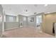 Bright hallway featuring carpet floors and access to different rooms of the home at 5624 Fisher Glen Loop, Wesley Chapel, FL 33545