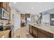Well-equipped kitchen featuring stainless steel appliances and a granite-topped island at 5624 Fisher Glen Loop, Wesley Chapel, FL 33545