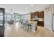 Bright, airy kitchen with bar seating, stainless steel appliances, and access to the dining area at 5624 Fisher Glen Loop, Wesley Chapel, FL 33545
