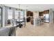 Bright kitchen with a central island, modern appliances, and an adjacent dining area at 5624 Fisher Glen Loop, Wesley Chapel, FL 33545