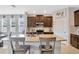 Kitchen with a large island, dark cabinets, and stainless steel appliances at 5624 Fisher Glen Loop, Wesley Chapel, FL 33545