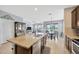 Modern kitchen showcasing a large island, stainless appliances, and an open floor plan at 5624 Fisher Glen Loop, Wesley Chapel, FL 33545