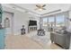 Spacious living room with tray ceiling, large windows, and stylish decor at 5624 Fisher Glen Loop, Wesley Chapel, FL 33545