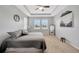 Spacious main bedroom featuring tray ceilings, carpet floors and lots of natural light at 5624 Fisher Glen Loop, Wesley Chapel, FL 33545