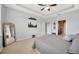 Open and airy main bedroom with tray ceilings and neutral tones at 5624 Fisher Glen Loop, Wesley Chapel, FL 33545