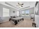 Spacious main bedroom featuring carpet floors, ceiling fan and lots of natural light at 5624 Fisher Glen Loop, Wesley Chapel, FL 33545