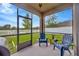 Relaxing screened patio with comfortable seating and string lights at 5624 Fisher Glen Loop, Wesley Chapel, FL 33545