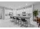Bright kitchen with white cabinets, an island with seating, and stainless steel appliances at 5742 Stockport St, Riverview, FL 33578