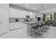Bright kitchen with white cabinets, an island with seating, and stainless steel appliances at 5742 Stockport St, Riverview, FL 33578