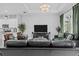 Cozy living room with comfortable couches, modern decor, and a view into the kitchen at 5742 Stockport St, Riverview, FL 33578