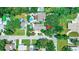 The aerial view showcases the lush landscaping and multiple pools on the property at 6011 Tangerine S Ave, Gulfport, FL 33707