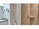 Bathroom showcases a tiled shower, modern fixtures, and a well-lit vanity area at 6011 Tangerine S Ave, Gulfport, FL 33707