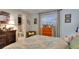 Bedroom features a window, colorful dresser, and convenient access to the en suite at 6011 Tangerine S Ave, Gulfport, FL 33707
