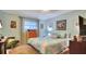 This bedroom provides a charming atmosphere with a window, wood floors, and cool walls at 6011 Tangerine S Ave, Gulfport, FL 33707
