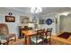 Traditional dining room featuring hardwood floors, chandelier lighting, decor, and vintage furnishings at 6011 Tangerine S Ave, Gulfport, FL 33707