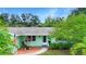 Attractive home features well-kept landscaping and a brick walkway leading to the front door at 6011 Tangerine S Ave, Gulfport, FL 33707