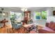 Bright and airy living room with large windows, hardwood floors, and comfortable seating arrangement at 6011 Tangerine S Ave, Gulfport, FL 33707