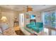 Bright main bedroom with light-colored hardwood flooring and comfortable seating at 6011 Tangerine S Ave, Gulfport, FL 33707