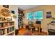 This office features a closet, window, and desk with shelving for organized functionality at 6011 Tangerine S Ave, Gulfport, FL 33707