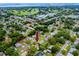 Location aerial view shows property near golf course, waterways, city; prime area at 614 12Th Nw St, Largo, FL 33770