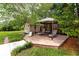 Spacious backyard featuring a wooden deck with a gazebo, perfect for outdoor relaxation at 614 12Th Nw St, Largo, FL 33770