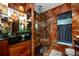 This tiled bathroom features a glass enclosed shower, modern fixtures, and updated tiling at 614 12Th Nw St, Largo, FL 33770