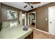 Bedroom featuring neutral tones, wood flooring, comfortable bedding, and an adjacent mirrored closet at 614 12Th Nw St, Largo, FL 33770