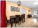 Cozy dining room with modern lighting fixture, wooden table and chairs, and stylish decor at 614 12Th Nw St, Largo, FL 33770